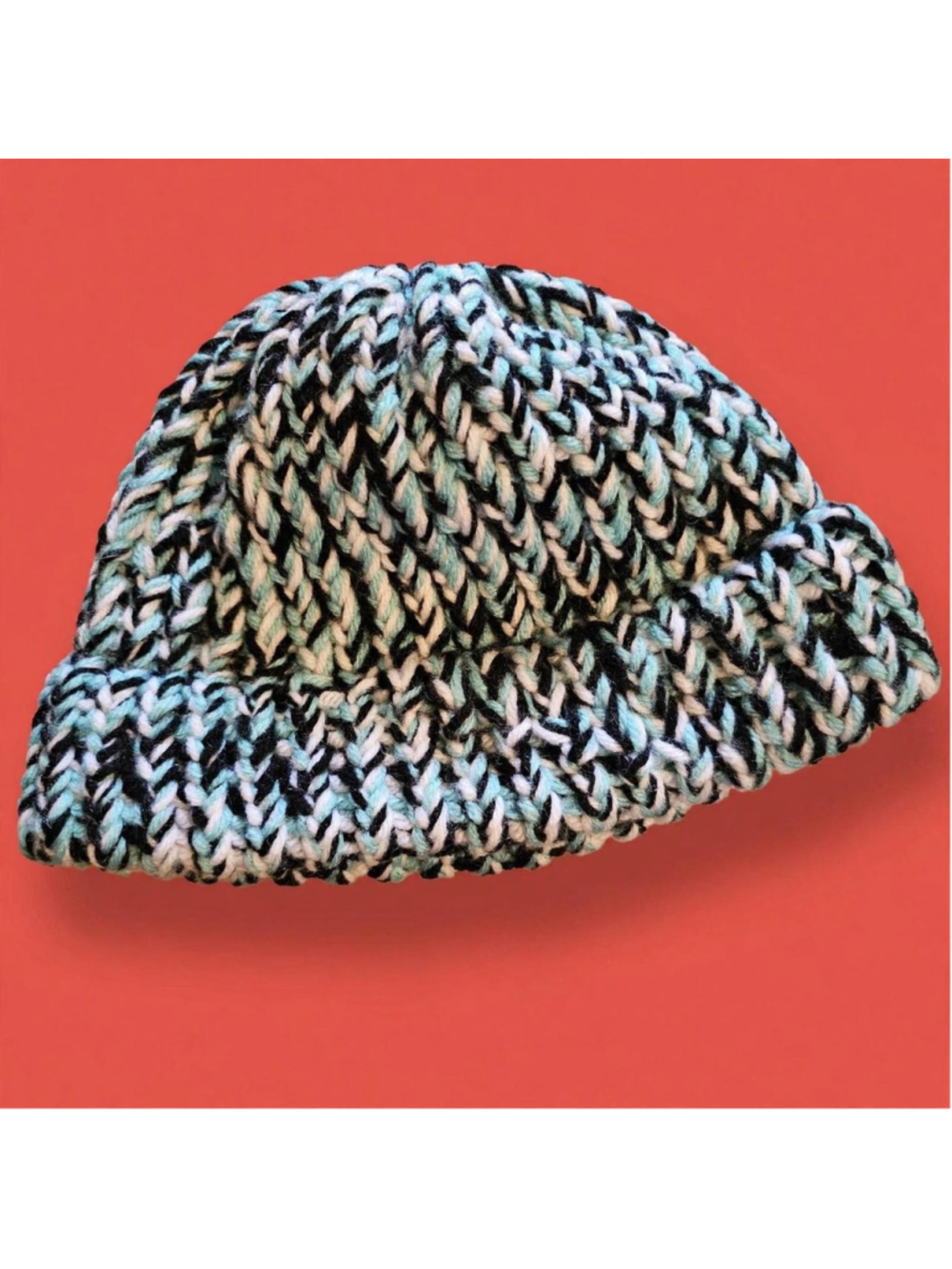 Black, white, and light blue knit beanie with a relaxed fit #winteraccessories #